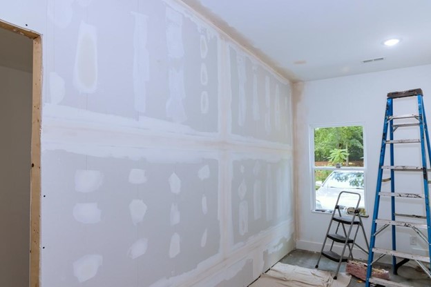 Preparing a home for painting the interior.